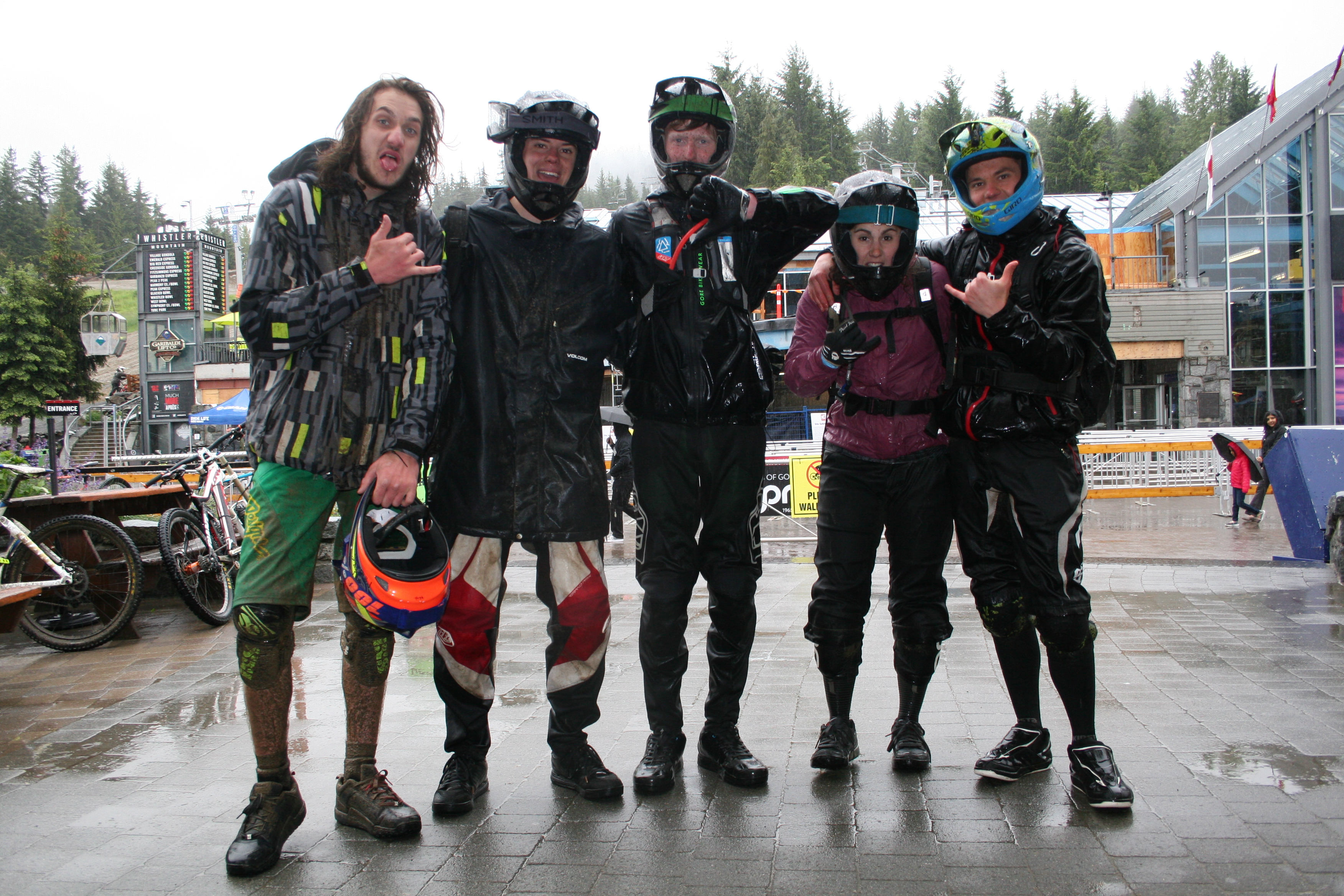 Off the mountain for a group photo despite being soaked through